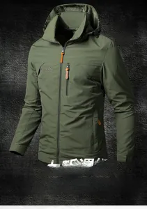 Detail of army green outdoor jacket featuring a waterproof zippered chest pocket and hood