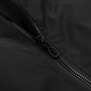 Detail of matte black metal zipper with woven cord puller on casual baseball jacket