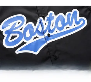 Close-up of black polo shirt with blue Boston letter print and durable round buttons