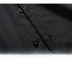 Detailed macro view of the single-breasted placket on a black breathable polo shirt