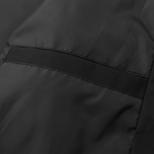 Detail of black baseball jacket featuring durable nylon fabric and double-stitched webbing