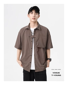 Detail of mocha brown short sleeve shirt with waffle texture and utility chest strap