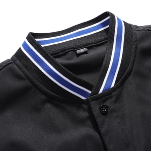 Detail of black jacket ribbed collar featuring blue and white stripes and inner size tag