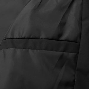 Macro shot of durable black synthetic fabric and smooth stitching on casual men's jacket