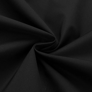 Detailed macro view of black woven fabric texture on a casual baseball jacket