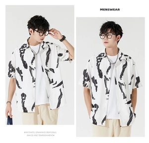 Detail of loose-fit white Hawaiian shirt with black abstract paint splash print for men
