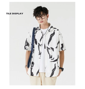 Detail of loose-fit men's Hawaiian shirt with black abstract prints and notched lapel