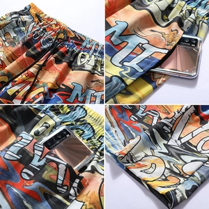 Detail of men's graffiti shorts showing elastic waistband and deep functional pockets