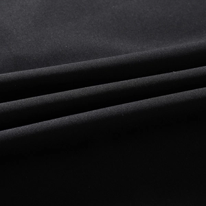 Detailed macro view of black breathable woven fabric texture for a men's polo shirt