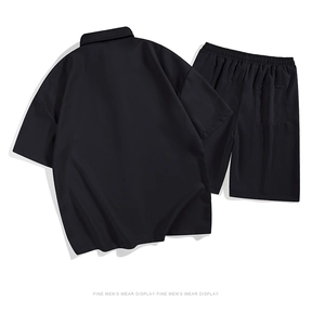 Detail of black ice silk fabric men's summer set showing textured shirt collar and pocket