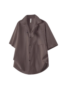 Men's brown short sleeve textured shirt with lapel collar and chest pocket details