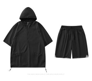 Detail of breathable mesh fabric on black summer quick-dry hooded tracksuit for men