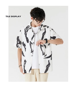 Detail of loose fit Hawaiian shirt with black abstract ink print and button-down collar