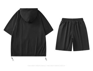 Detail view of the breathable mesh inner pocket and adjustable drawstring hem on black set