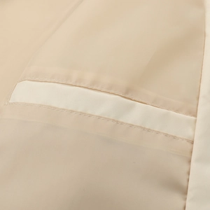 Macro detail of men's jacket inner lining with reinforced horizontal pocket and double stitching
