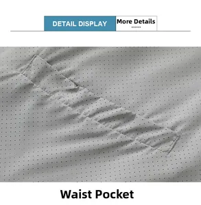 Detail view of the breathable mesh fabric and flat waist pocket on a gray techwear jacket