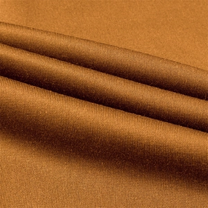 Close-up of brown knitted fabric texture showing the premium weave of a baseball jacket