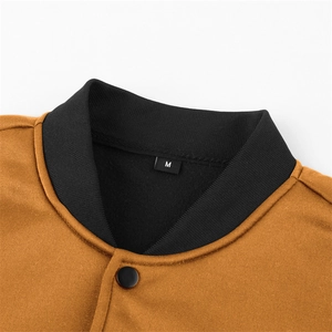 Close-up of baseball collar with black rib-knit trim and size M tag on yellow jacket