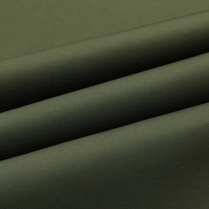 Macro detail of olive green breathable textile fabric with durable weave and soft folds