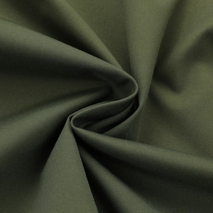 Close-up detail of durable army green breathable fabric texture on a men's jacket