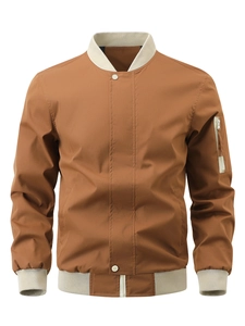 Detail of caramel bomber jacket with cream ribbed cuffs and sleeve utility pocket