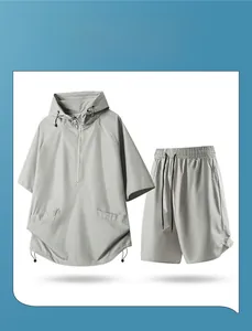 Detail of grey quick-dry hooded sportswear set showing breathable perforated texture