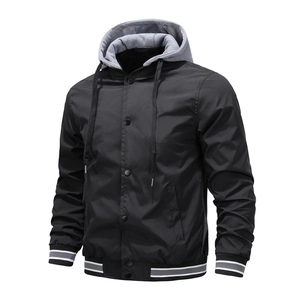 Detail of the hooded baseball jacket featuring grey drawstring and black snap buttons