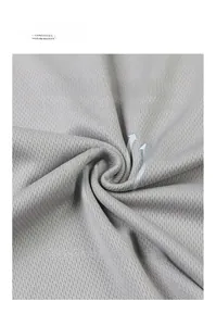 Close-up detail of light grey breathable mesh fabric for summer athletic sports jersey