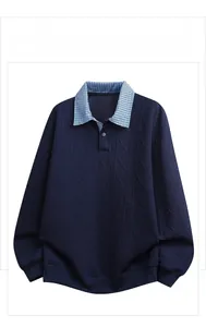 Detail of the navy men's polo shirt featuring a plaid collar and textured jacquard pattern