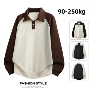 Detail of waffle knit fabric and color block raglan sleeves on plus size men's polo sweatshirt
