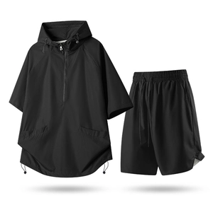 Detail of loose-fit quick-dry sports set showing breathable mesh fabric and half-zipper hood