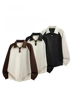 Detail view of waffle-textured polo shirts with contrast raglan sleeves and polo collar
