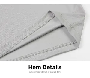 Detail view of light gray breathable mesh shorts hem showing high-quality double-needle stitching