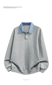 Detail of grey sweatshirt showing plaid collar and braided cable knit jacquard texture