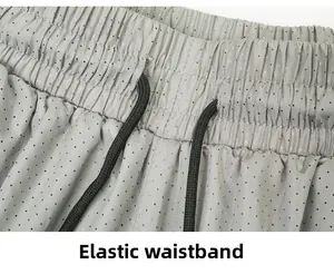 Detail view of the breathable mesh fabric with elastic waistband and black drawstring