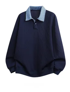 Detailed close-up of navy knit sweatshirt with cable texture and plaid turnover collar