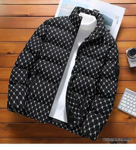 Detail of winter men's puffer jacket with white B letter monogram pattern and stand collar