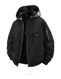Detail of hooded windbreaker featuring plaid lining and a utility sleeve zipper pocket