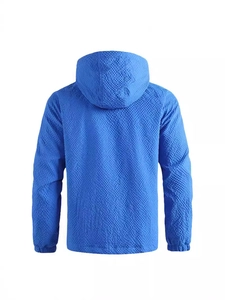 Back view of blue hooded outdoor jacket with windproof honeycomb texture and elastic cuffs