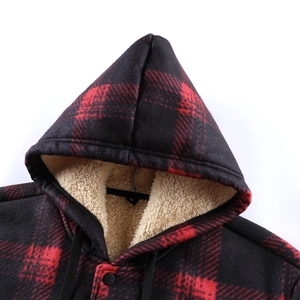 Detail of red plaid winter jacket with thick cream sherpa lining and black hood drawstring