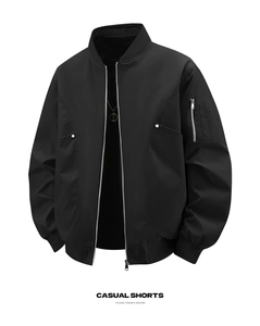 Detail of bomber jacket featuring sleeve utility pocket and silver metal zipper design