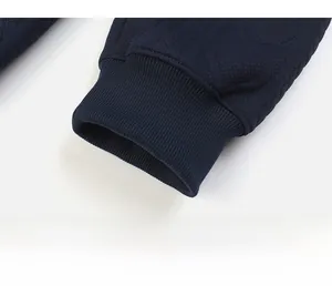 Detail of dark blue ribbed cuffs on men's sweatshirt with textured jacquard fabric