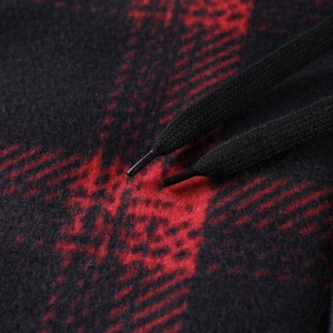 Detailed close-up of red and black plaid fleece jacket featuring durable black drawstrings