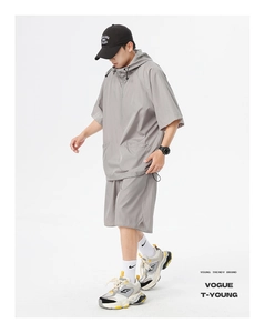 Detail of light gray short sleeve hooded sweatshirt and breathable mesh fabric texture