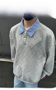 Close-up of men's grey long sleeve polo shirt with textured diamond jacquard pattern