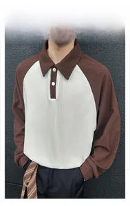 Macro detail of men's polo sweatshirt featuring brown color-block and jacquard texture