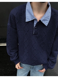Detail of navy knit polo sweatshirt with plaid collar layering and 3D textured fabric