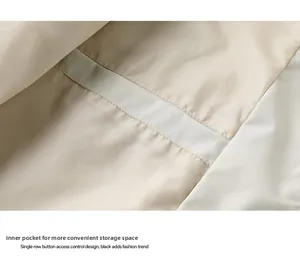 Detail view of the beige inner pocket for secure storage on a men's outdoor sport jacket
