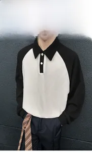 Detail of waffle knit fabric and black contrast polo collar on men long sleeve shirt