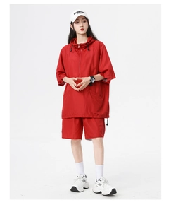 Detail view of red quick-dry hooded sportswear set with short sleeves and matching shorts